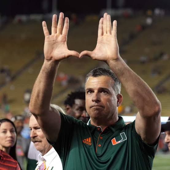Mario Cristobal of the Miami Hurricanes faces a $600K ultimatum as his coaching future is threatened by thunderstorm predictions.