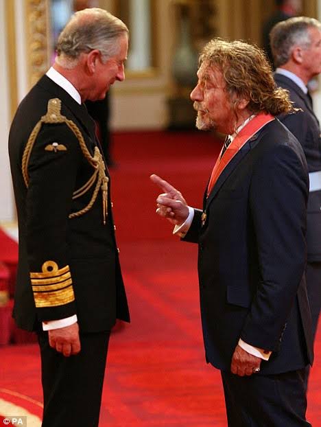 Former Led Zeppelin frontman Robert Plant receives his Order of the British Empire (CBE) from Britain’s Prince Charles during an investiture ceremony at Buckingham Palace in London on Friday, July 10, 2009….